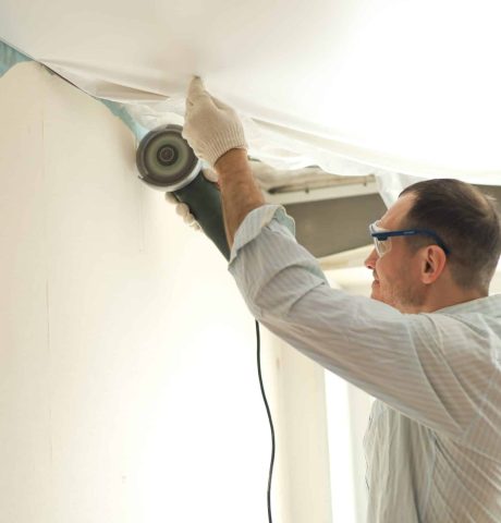 a-man-in-goggles-and-gloves-makes-repairs-while-st-2025-01-08-03-01-26-utc