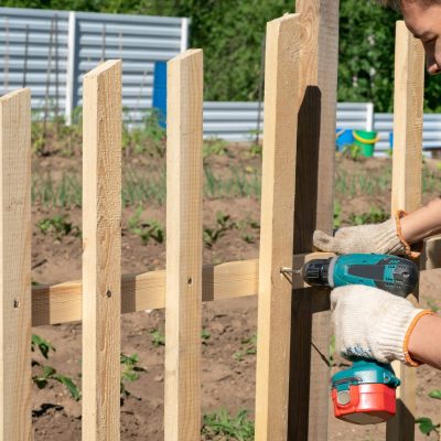 a-young-man-makes-a-picket-fence-with-a-screwdrive-2025-02-10-14-40-23-utc